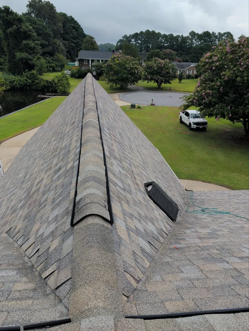 Ridge vent and a box vent on a new tan shingle roof