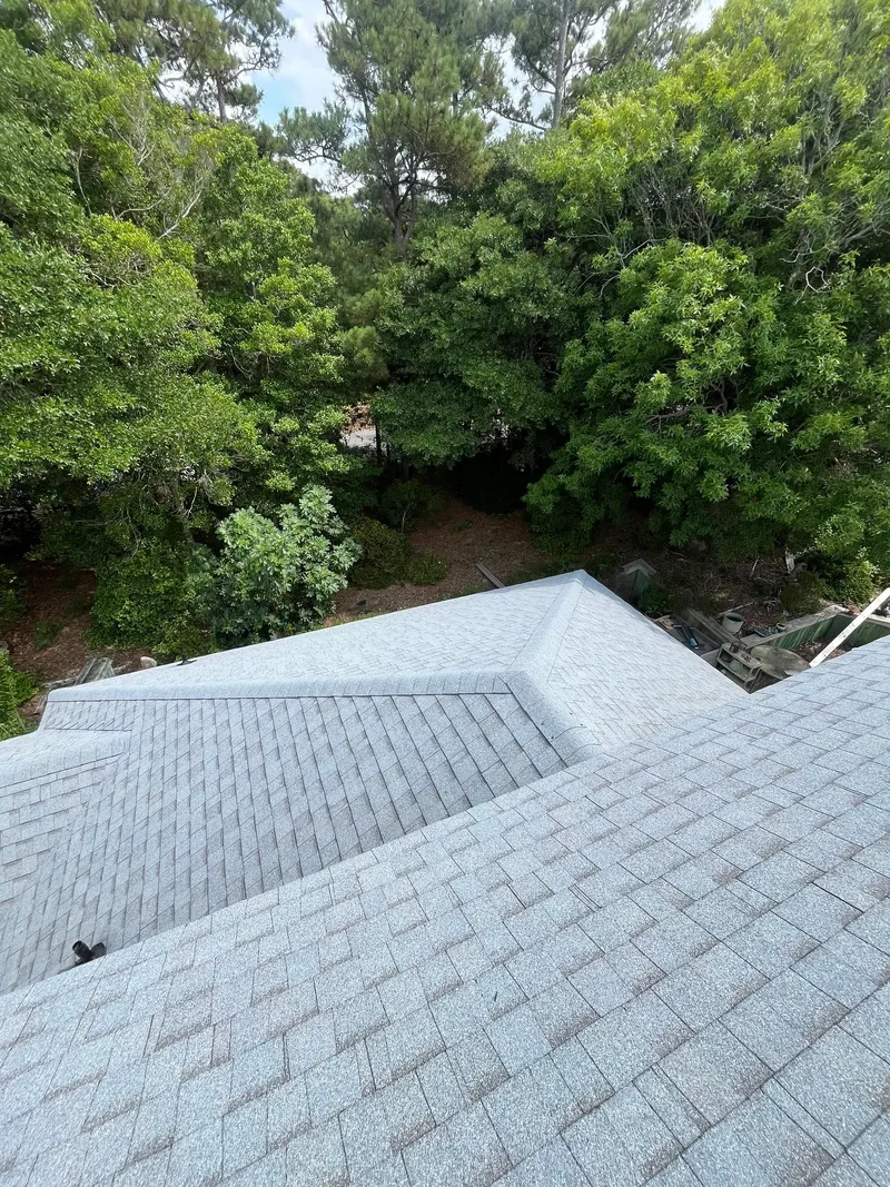 Finished light gray shingle roof hips and valleys