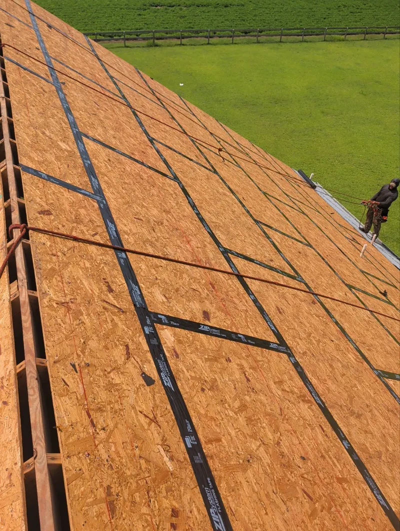 Roof ridge opening with taped deck seams on both slopes